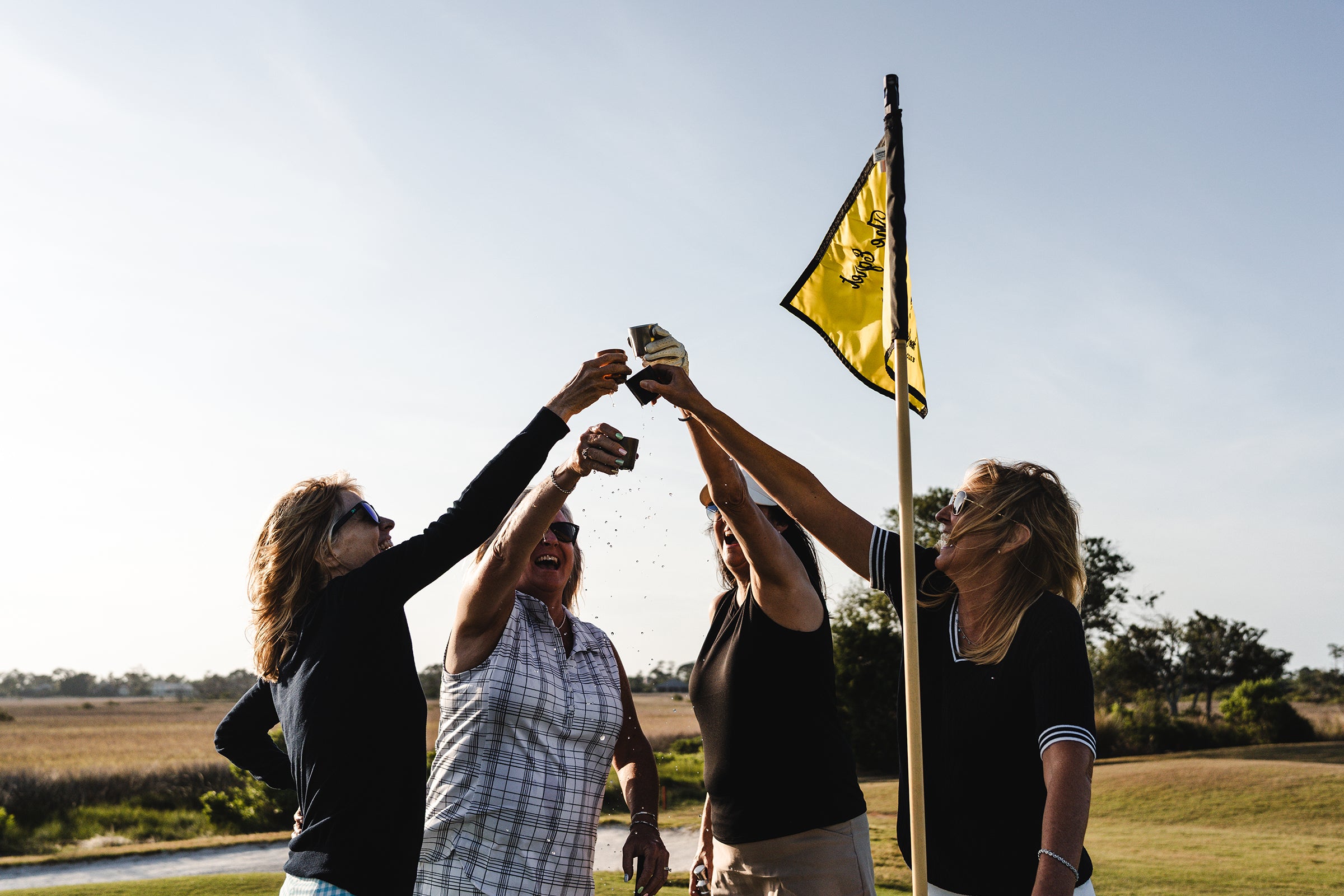 Celebrating on the golf course with the Torch Flask.